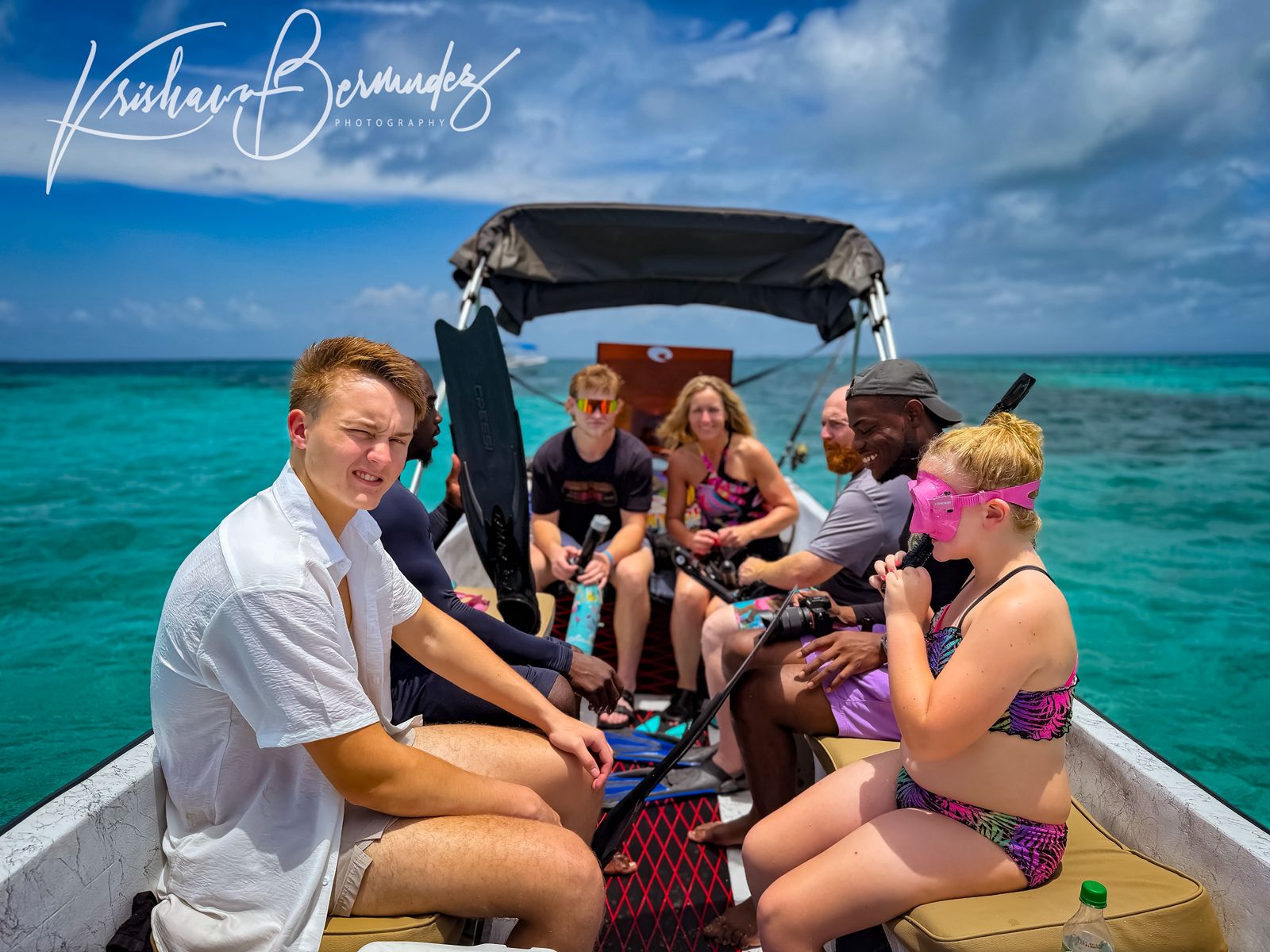South Water Caye Belize aerial view with thatched cabanas and turquoise reef